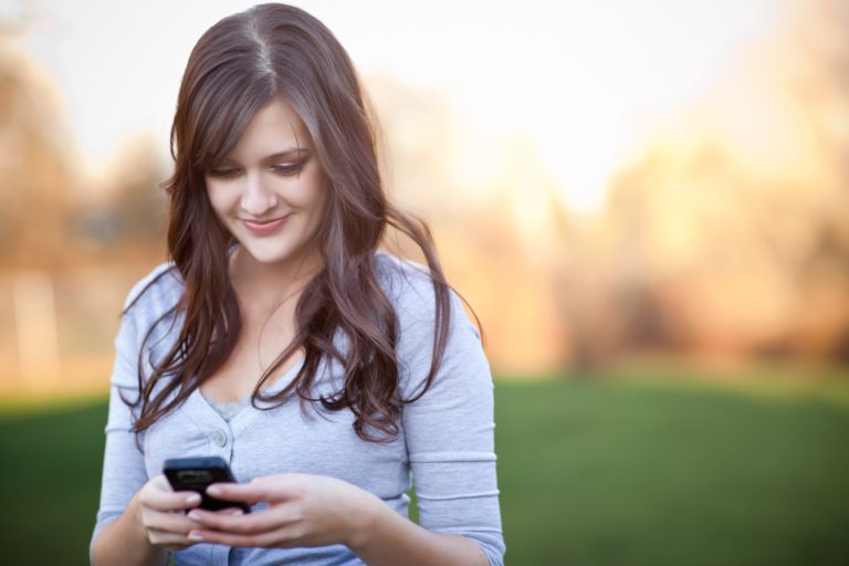 girl responding to voicemail with a text